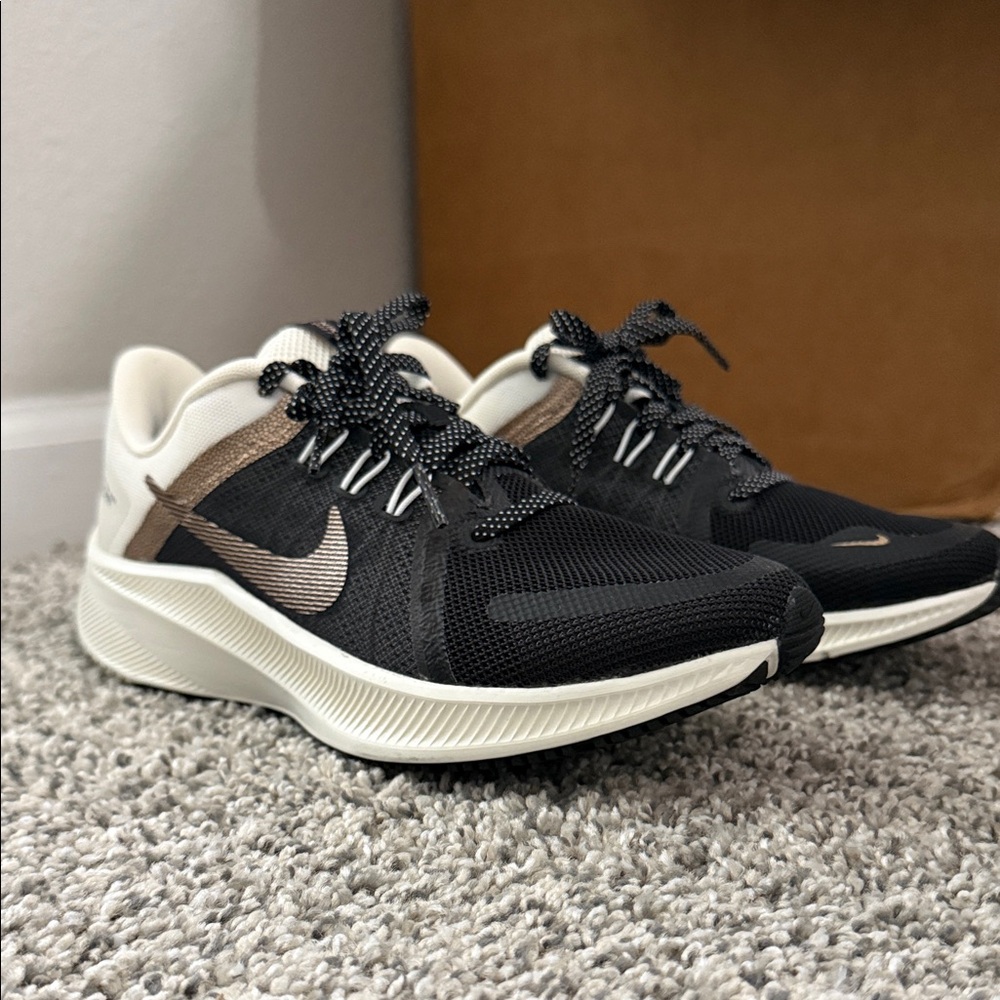 Nike Black and Cream Sneakers with Bronze Swoosh